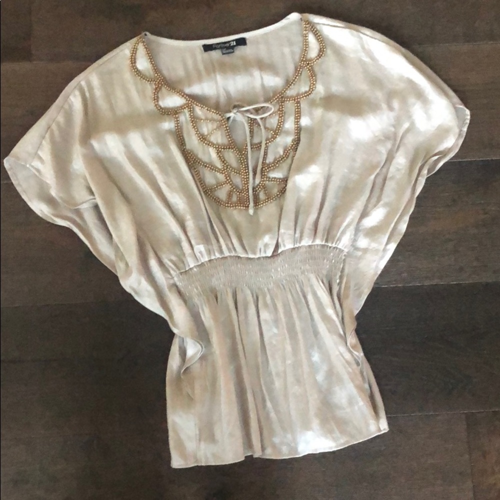 Beige blouse with beading